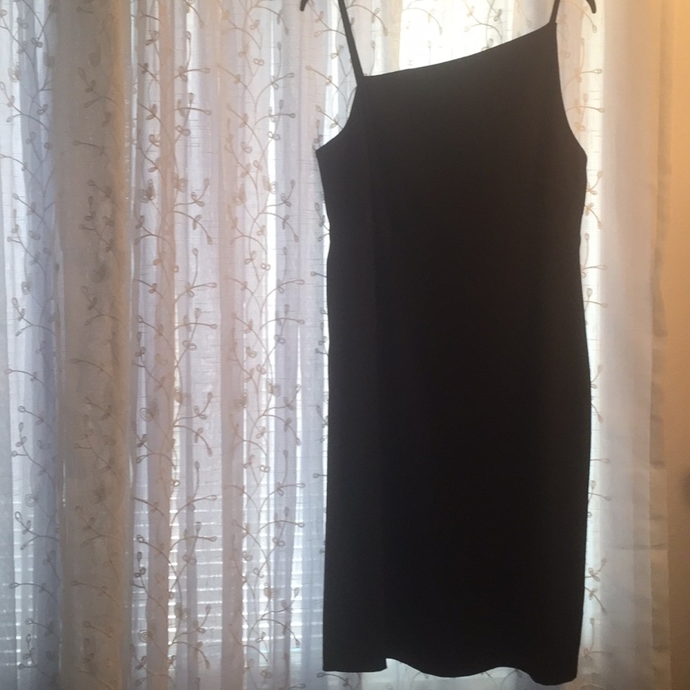 Black dressed, spaghetti strap.